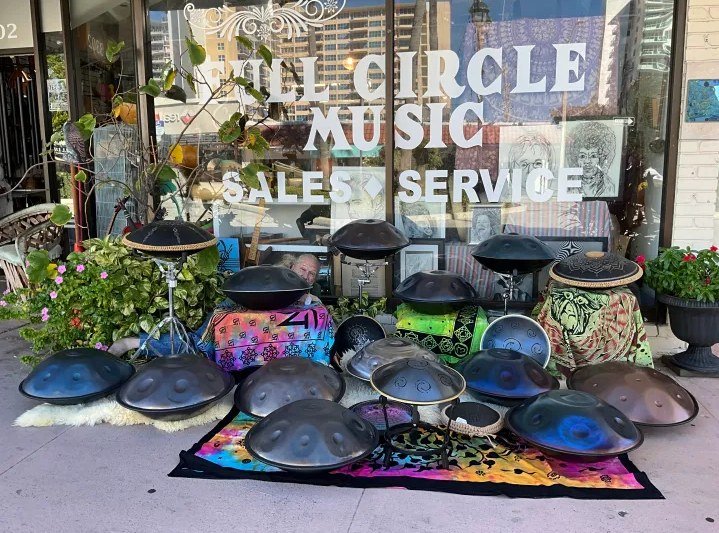 A display of handpans and world percussion instruments outside Full Circle Music