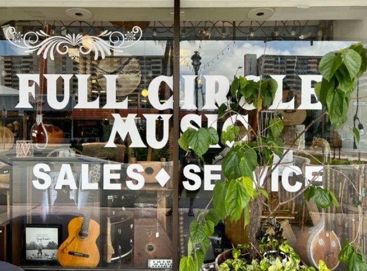 Full Circle Music storefront window, Sales and Service